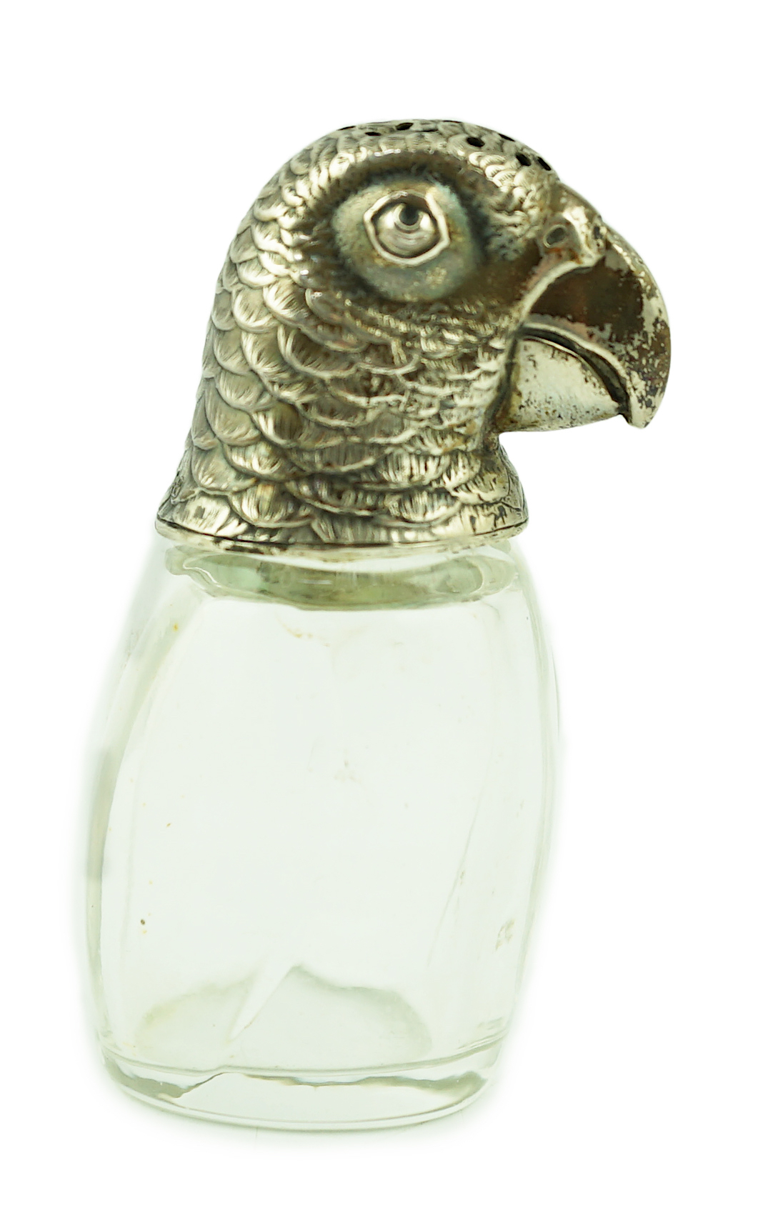 An early 20th century German 800 standard silver mounted glass pepperette, the cover modelled as the head of a parrot